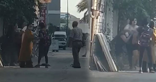 Kadınlar saç saça baş başa kavga etti, erkekler film izler gibi izledi
