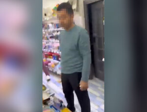 Kırtasiyede genç kızın fotoğrafını çeken şüpheliye müdahale